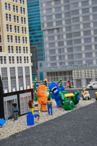 one of the many comical scenes in the streets of New York in miniland at legoland New York resort