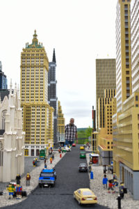 street view of New York City in miniland at legoland New York resort, with a human in the back for size reference