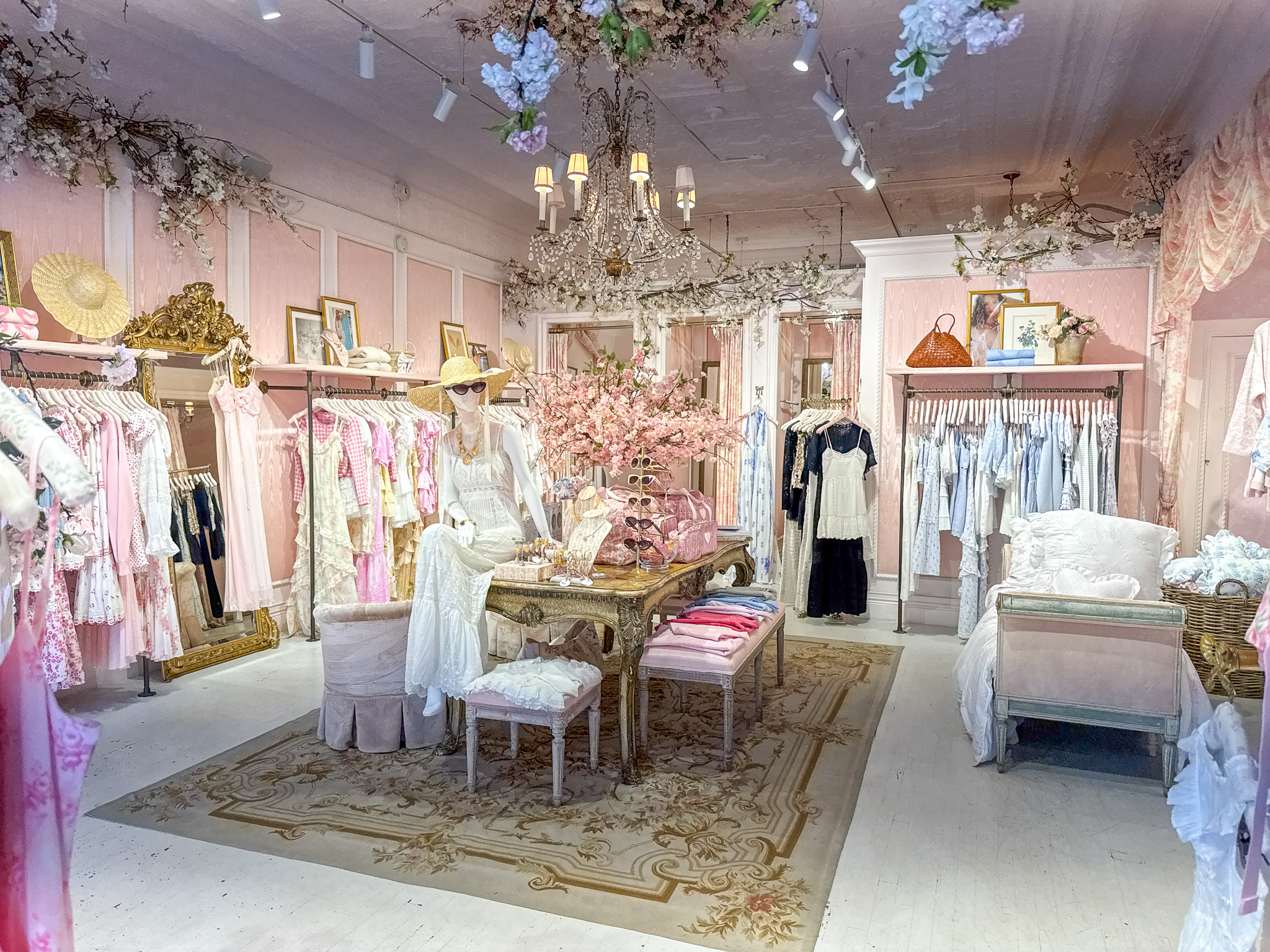 The pink, floral interior of a Love Shack Fancy store.