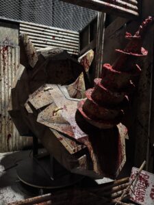 Close-up of a blood-soaked mechanical rhino with sharp metal points inside MADLANDS: Caged Cannibals
