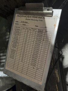 Prop patient intake clipboard for the fictional 'Shadybrook Rest Home and Sanitarium,' a detail from Jack & Oddfellow: Chaos & Control