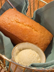 Boatwright's famous cornbread loaf, with butter in a basket